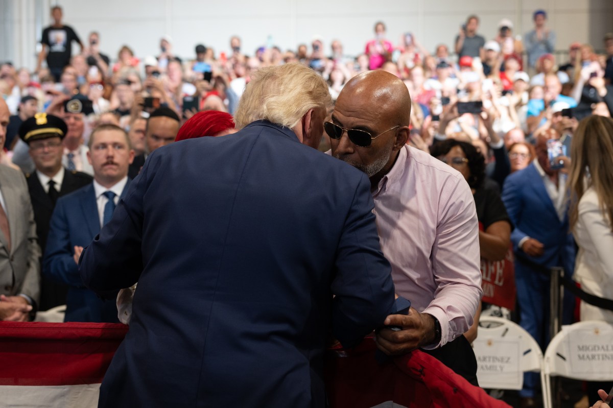President Donald J. Trump embraces the family of 12-year-old Jacob Freytes, as he delivers remarks at the David S. Mack Center for Training and Intelligence in Garden City, New York, Friday, August 14, 2026. (Official White House Photo by Molly Riley)