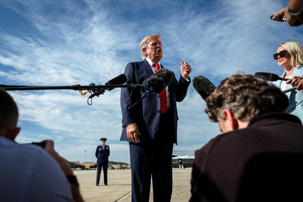 President Donald J. Trump speaks with members of the media alongside outgoing White House Press Secretary Karoline Leavitt, before boarding Air Force One at Joint Base Andrews, Maryland, Friday, August 21, 2026, en route to South Carolina. (Official White House Photo by Molly Riley)