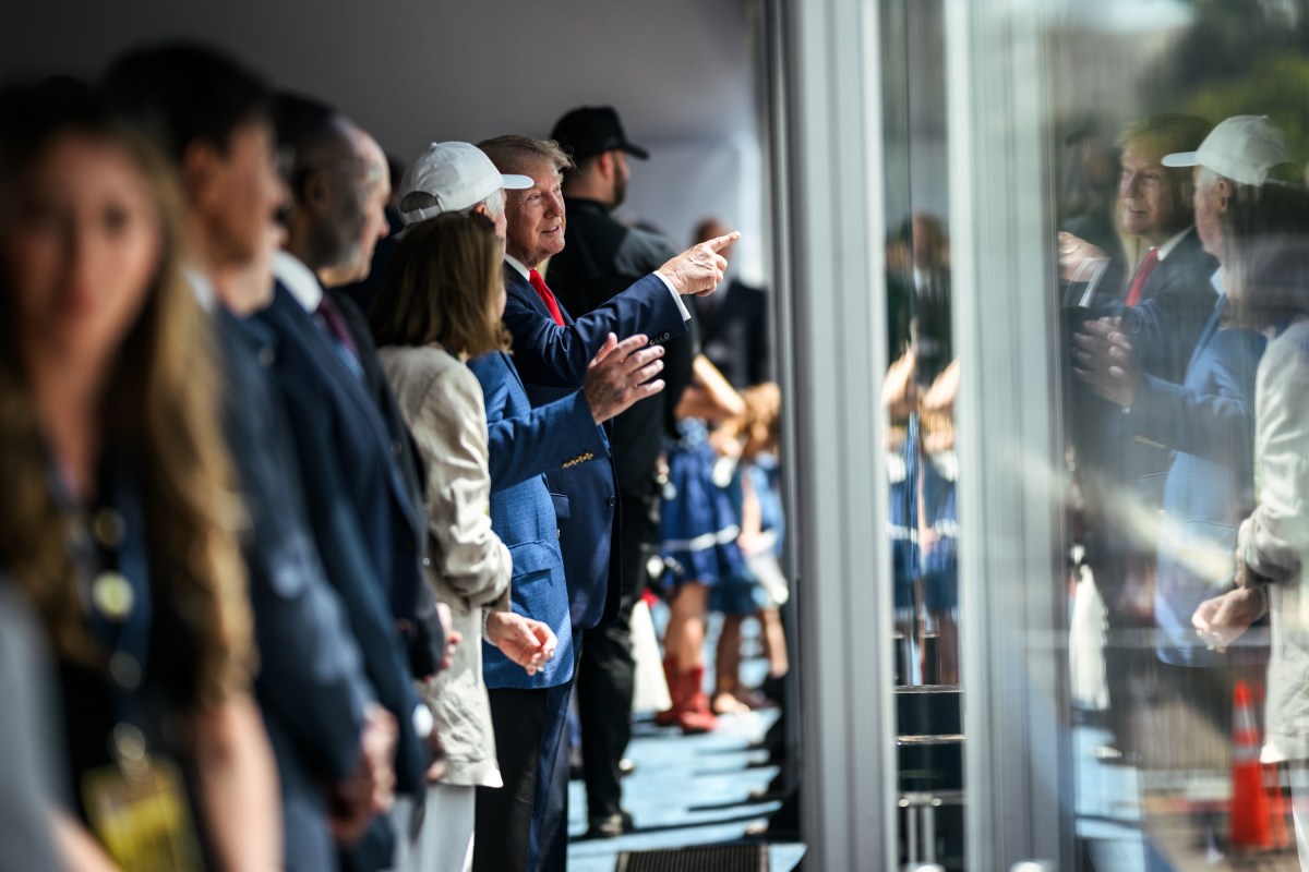 President Donald J. Trump and First Lady Melania Trump participate in the Green Flag Presentation before the Freedom 250 Grand Prix Race in Washington, D.C., Sunday, August 23, 2026. (Official White House Photo by Daniel Torok)