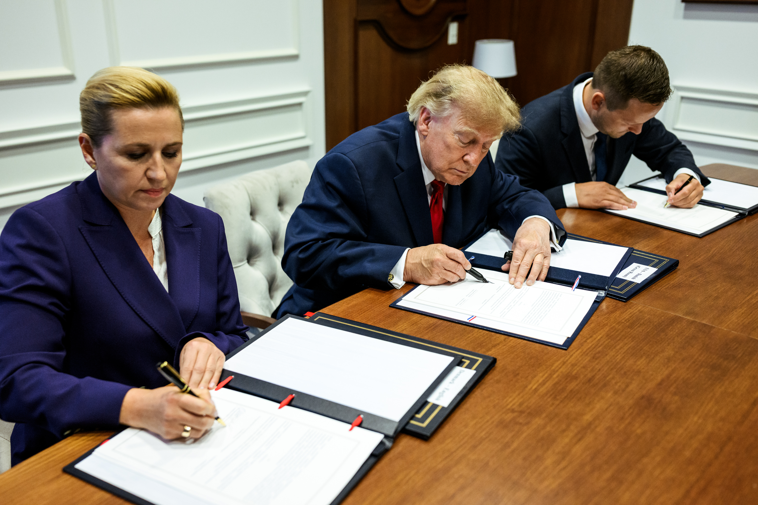 President Donald J. Trump participates in a trilateral signing ceremony with Prime Minister Mette Frederiksen of Denmark and Prime Minister Jans-Frederik Nielsen of Greenland, Tuesday, September 22, 2026, at United Nations Headquarters in New York City. (Official White House Photo by Daniel Torok)