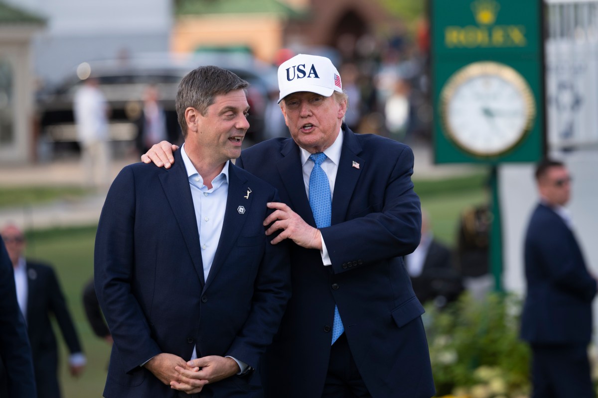 President Donald J. Trump walks with PGA Tour CEO Brian Rolapp prior to  presenting the President’s Cup Trophy to the USA Team after winning the 2026 President’s Cup on Sunday, September 27, 2026, at Medinah Country Club in Medinah, Illinois. (Official White House photo by Joyce N. Boghosian)