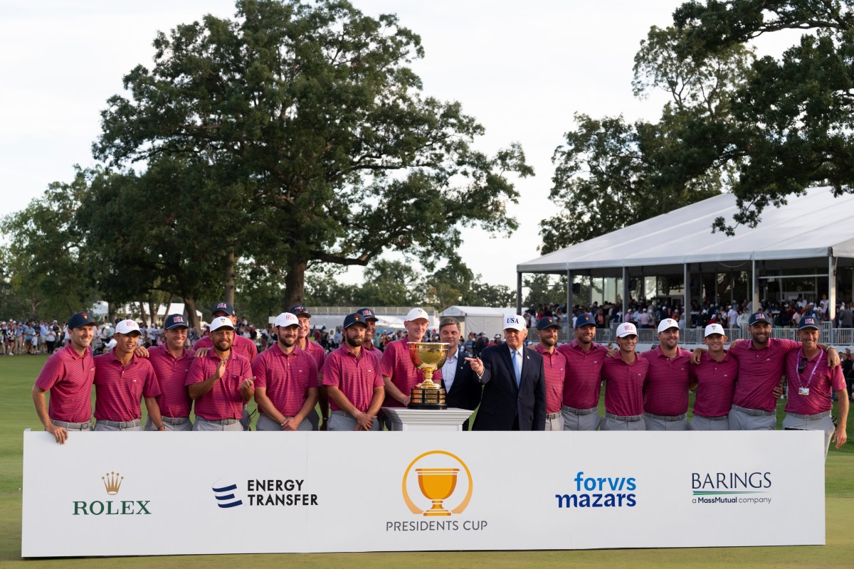 President Donald J. Trump and PGA Tour CEO Brian Rolapp present the President’s Cup Trophy to the USA Team Captain Brandt Snedeker after winning the 2026 President’s Cup on Sunday, September 27, 2026, at Medinah Country Club in Medinah, Illinois. (Official White House photo by Joyce N. Boghosian)