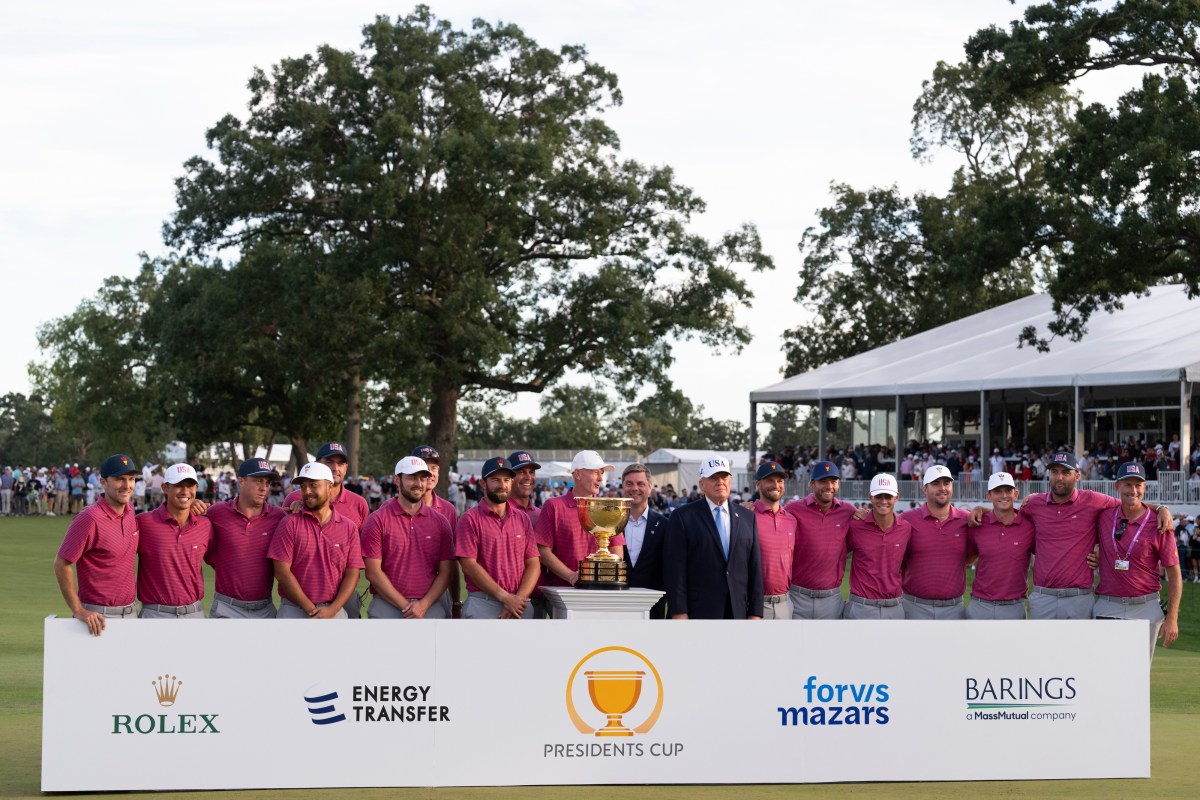 President Donald J. Trump and PGA Tour CEO Brian Rolapp present the President’s Cup Trophy to the USA Team Captain Brandt Snedeker after winning the 2026 President’s Cup on Sunday, September 27, 2026, at Medinah Country Club in Medinah, Illinois. (Official White House photo by Joyce N. Boghosian)