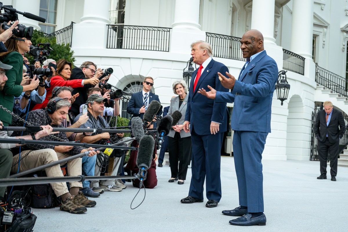 President Donald J. Trump speaks with members of the media alongside Mike Tyson before boarding Marine One on the South Lawn of the White House, Friday, October 9, 2026, en route to Joint Base Andrews for a trip to Syracuse, New York. (Official White House Photo by Joyce N. Boghosian)