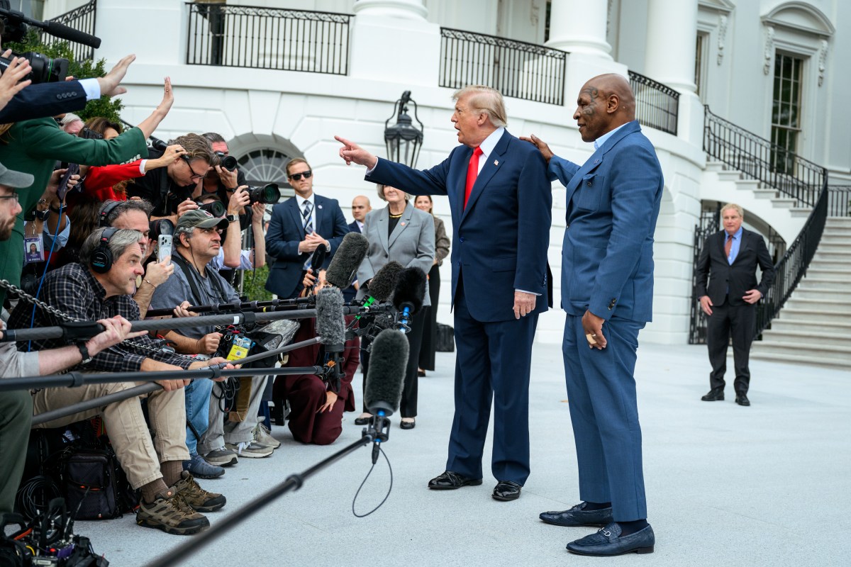President Donald J. Trump speaks with members of the media alongside Mike Tyson before boarding Marine One on the South Lawn of the White House, Friday, October 9, 2026, en route to Joint Base Andrews for a trip to Syracuse, New York. (Official White House Photo by Joyce N. Boghosian)
