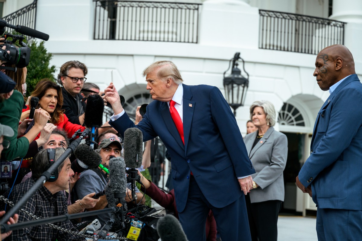 President Donald J. Trump speaks with members of the media alongside Mike Tyson before boarding Marine One on the South Lawn of the White House, Friday, October 9, 2026, en route to Joint Base Andrews for a trip to Syracuse, New York. (Official White House Photo by Joyce N. Boghosian)