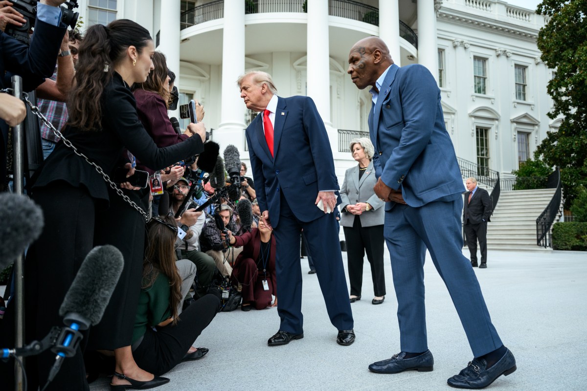 President Donald J. Trump speaks with members of the media alongside Mike Tyson before boarding Marine One on the South Lawn of the White House, Friday, October 9, 2026, en route to Joint Base Andrews for a trip to Syracuse, New York. (Official White House Photo by Joyce N. Boghosian)