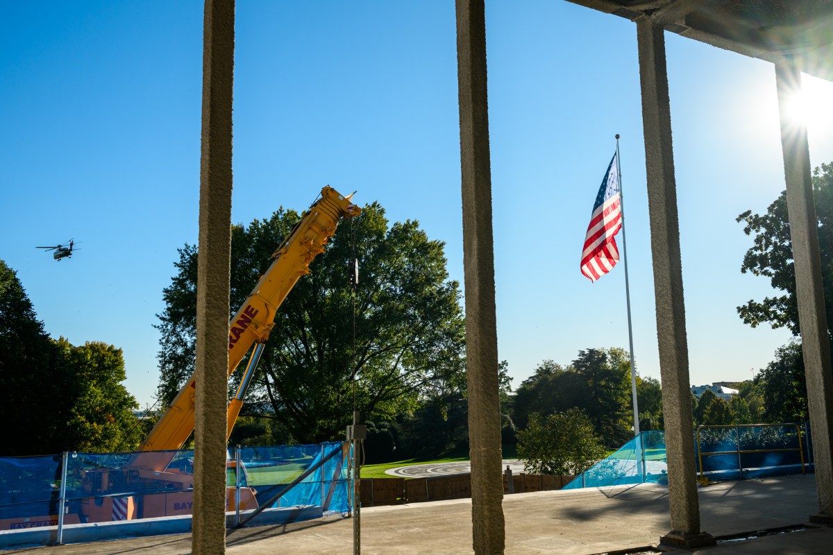 Marine One flies over construction of the East Wing and White House Ballroom, Thursday, October 22, 2026, en route Joint Base Andrew for a campaign trip to Sioux City, Iowa. (Official White House Photo by Joyce N. Boghosian)