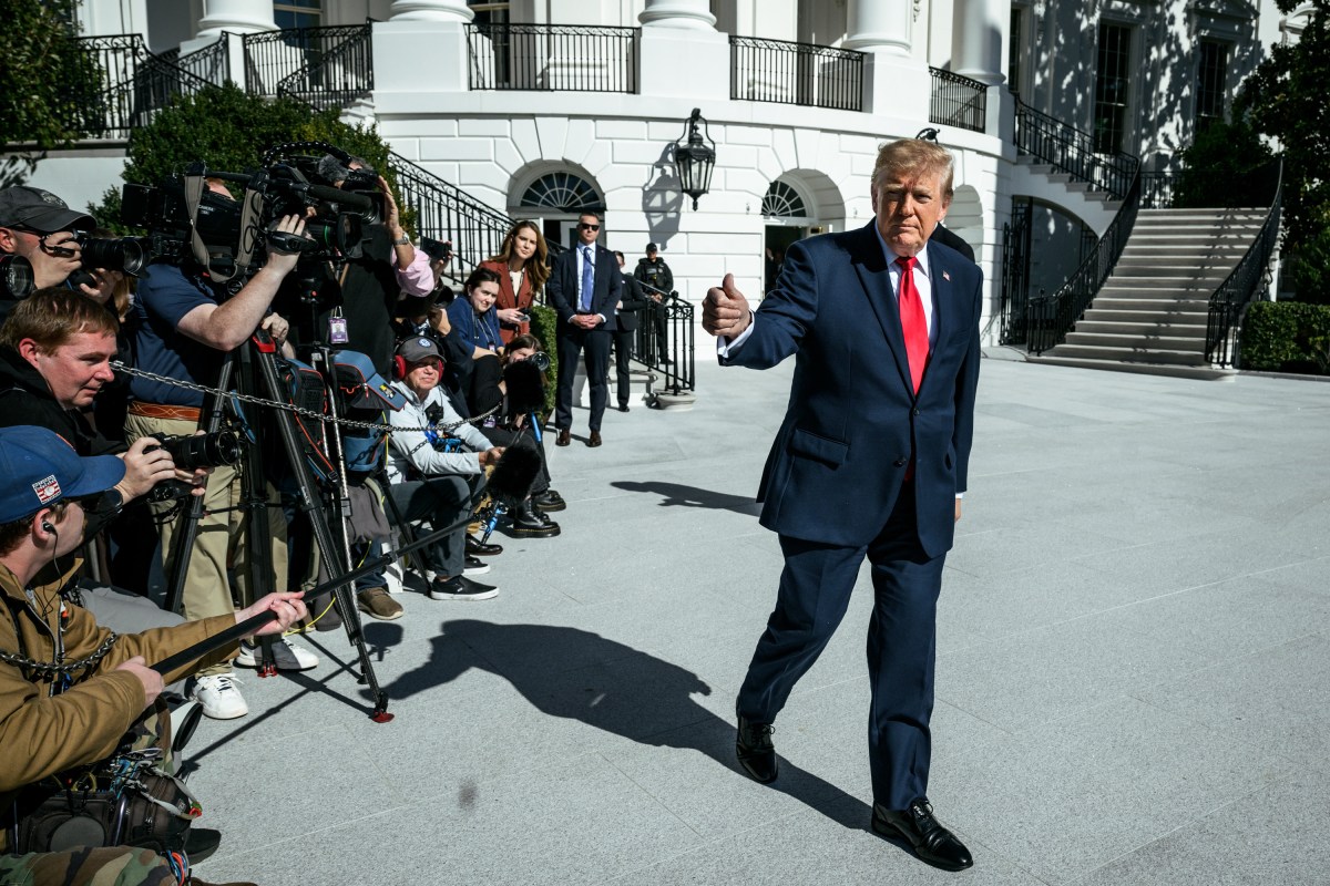 President Donald J. Trump speaks to members of the media before boarding Marine One on the South Lawn of the White House, en route to Michigan for a midterm rally, Sunday, October 25, 2026. (Official White House Photo by Patrick Witty)